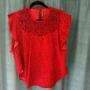 Red patterned blouse from Anthropologie size small.